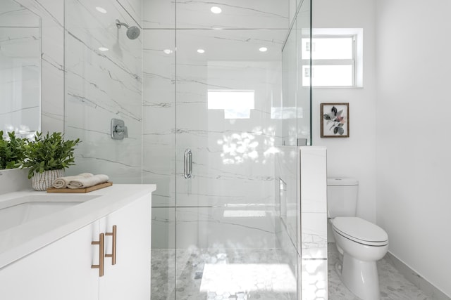 full bathroom featuring a marble finish shower, marble finish floor, toilet, and vanity