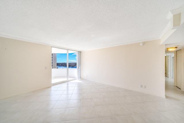 tiled spare room with ornamental molding, expansive windows, and a water view