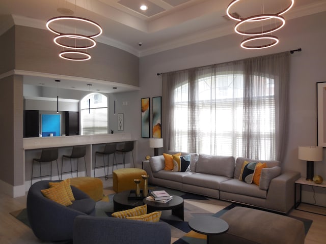 unfurnished living room featuring ceiling fan, crown molding, and light hardwood / wood-style flooring