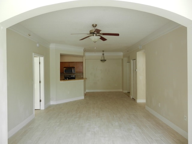 unfurnished living room with ceiling fan, crown molding, and light hardwood / wood-style floors