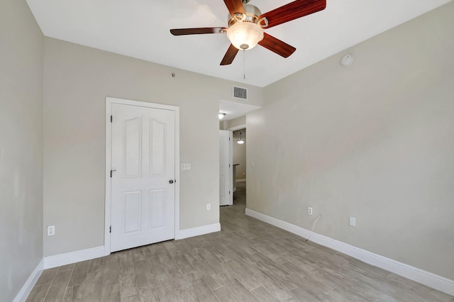 unfurnished bedroom featuring ceiling fan and light wood-type flooring