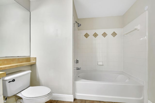 full bathroom featuring toilet, tiled shower / bath, vanity, and tile patterned floors