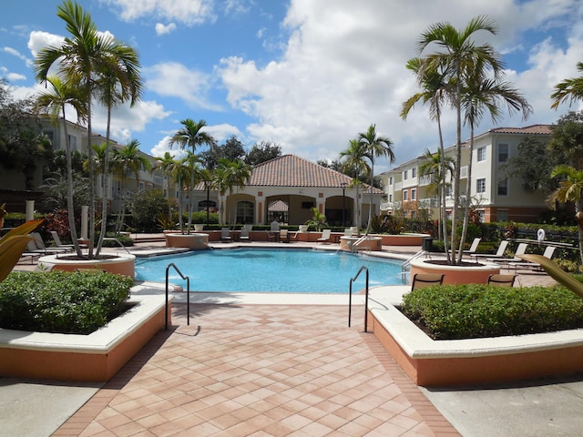 view of swimming pool with a patio area