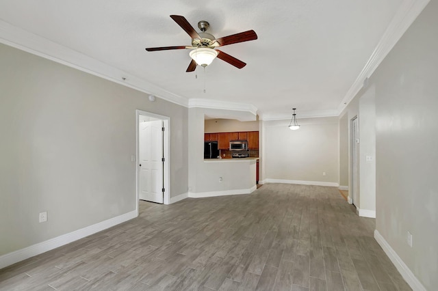 dining space featuring light hardwood / wood-style floors, a raised ceiling, and crown molding