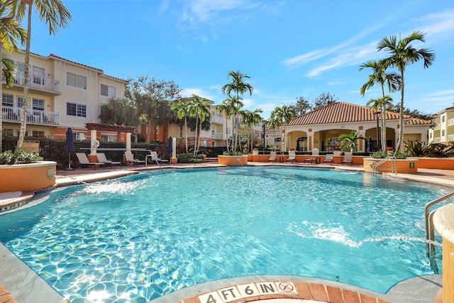 view of pool featuring pool water feature and a patio area