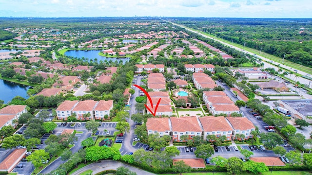 birds eye view of property featuring a water view