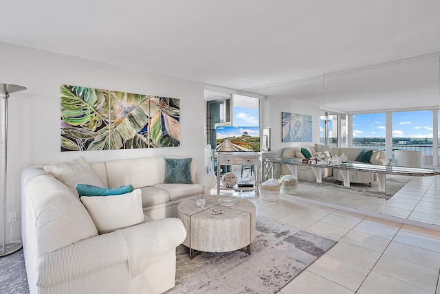 living room featuring tile flooring and a wall of windows