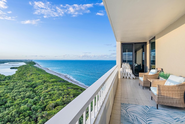 balcony with an outdoor hangout area and a water view