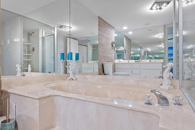 bathroom with vanity with extensive cabinet space and plus walk in shower