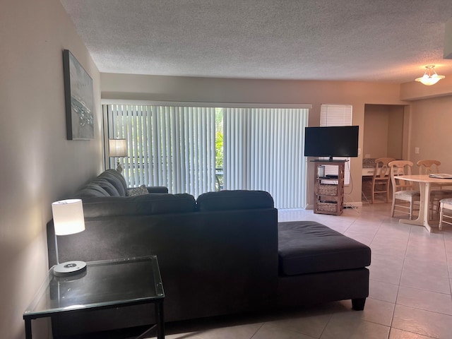 living room with tile flooring and a textured ceiling