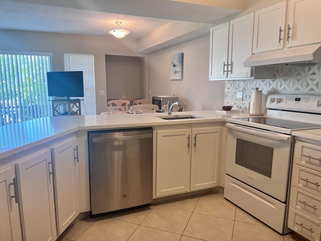 kitchen with custom range hood, backsplash, stainless steel dishwasher, sink, and white electric stove