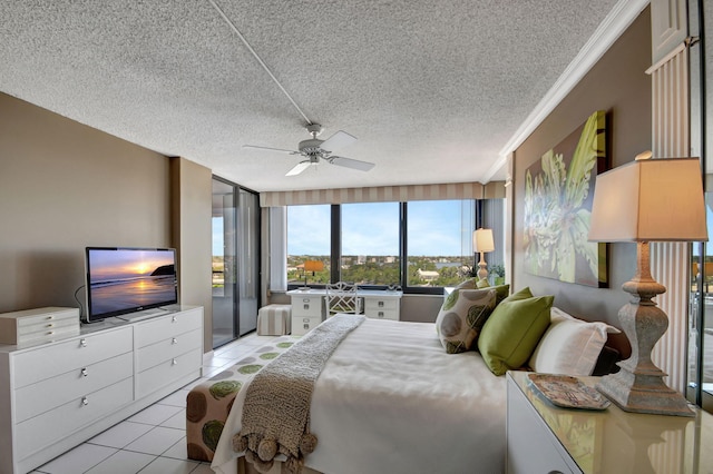 bedroom featuring light tile patterned floors, ceiling fan, and a textured ceiling