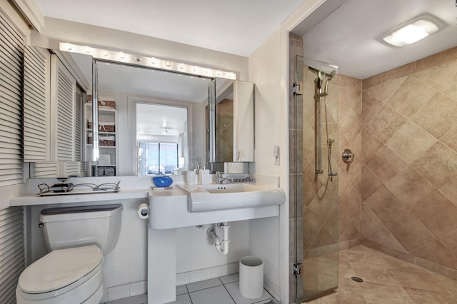 full bathroom with a stall shower, tile patterned flooring, and toilet