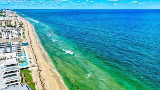 bird's eye view featuring a beach view and a water view