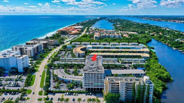 bird's eye view featuring a water view and a view of city