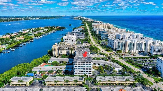 bird's eye view featuring a water view and a view of city