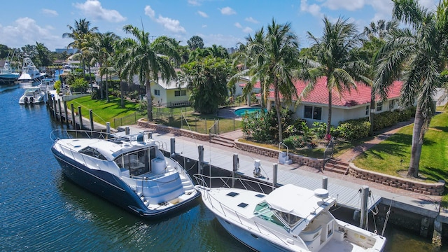 dock area featuring a yard and a water view