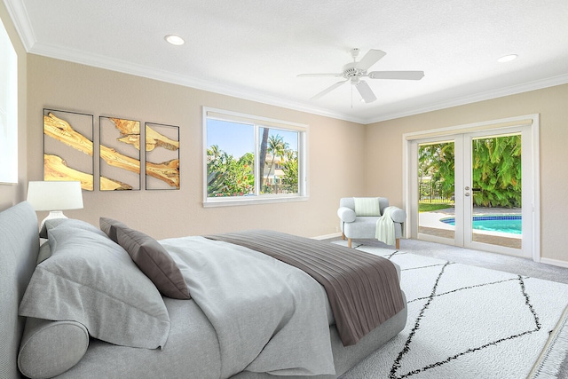 bedroom featuring multiple windows, french doors, ornamental molding, and access to outside