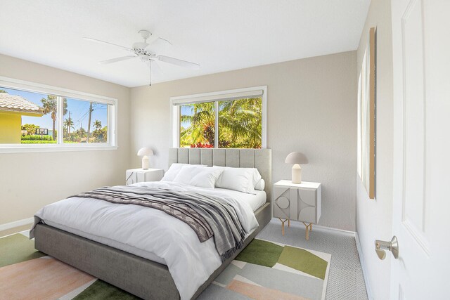 carpeted bedroom with ceiling fan