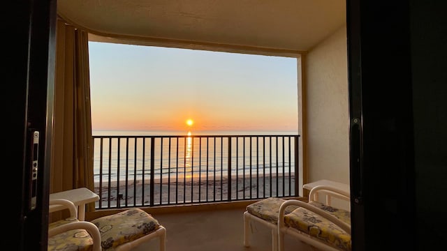 balcony at dusk with a water view