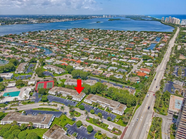 birds eye view of property featuring a water view