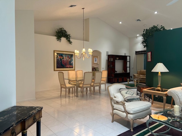 living room with high vaulted ceiling, a notable chandelier, and light tile flooring