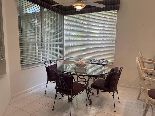 dining room featuring ceiling fan and light tile floors