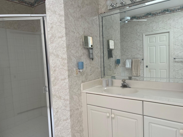 bathroom with walk in shower and vanity