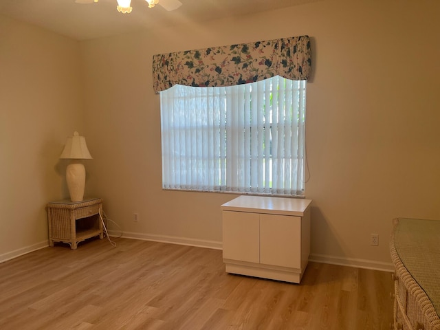 empty room featuring hardwood / wood-style floors and ceiling fan