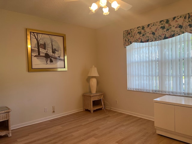 interior space with hardwood / wood-style floors and ceiling fan