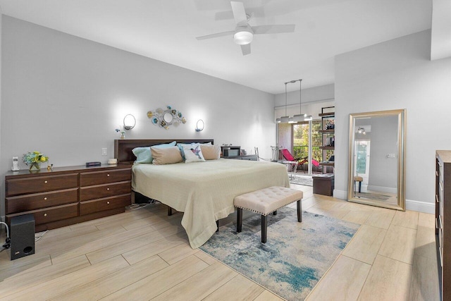 bedroom with light hardwood / wood-style flooring and ceiling fan