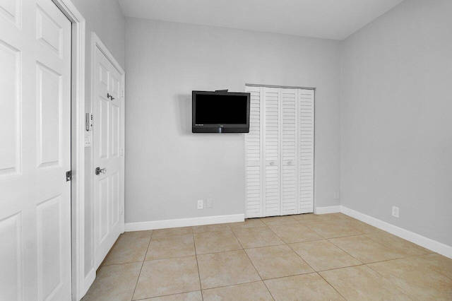 unfurnished bedroom featuring light tile patterned floors