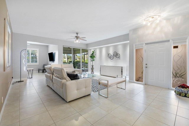 tiled living room featuring ceiling fan