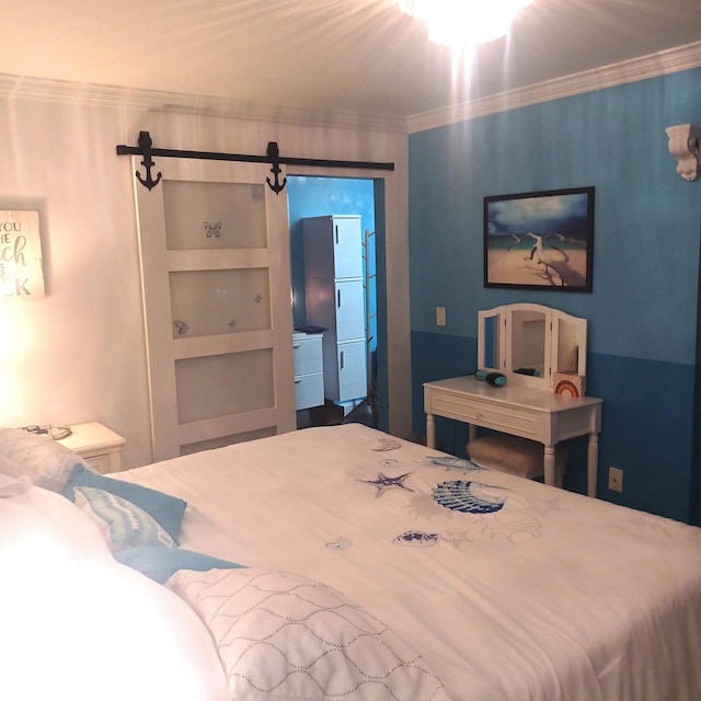 bedroom with crown molding and a barn door