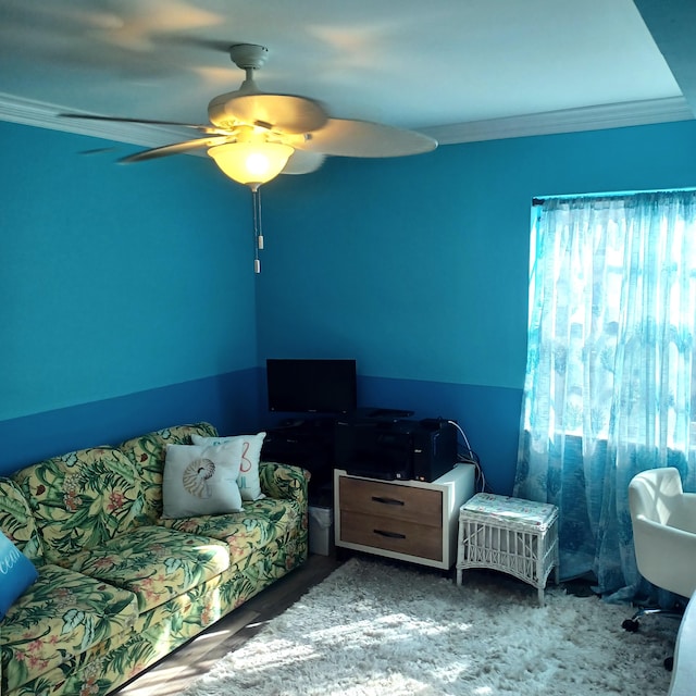 bedroom featuring ornamental molding and ceiling fan