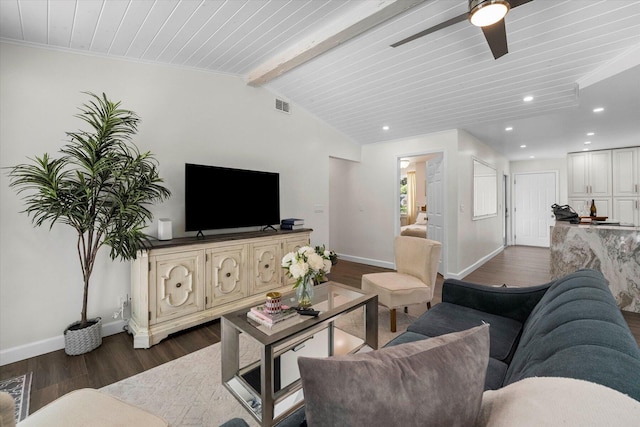 living room with dark hardwood / wood-style flooring, beam ceiling, and ceiling fan