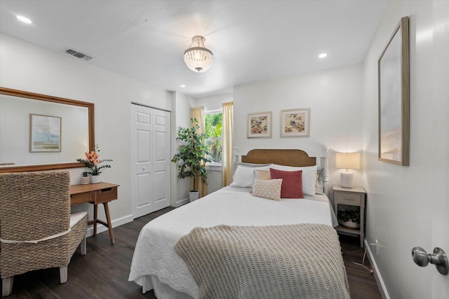 bedroom featuring a closet and dark hardwood / wood-style floors