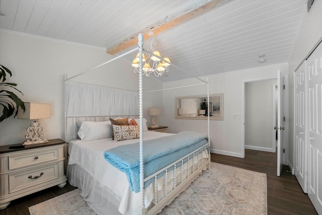 bedroom featuring ornamental molding, beamed ceiling, dark hardwood / wood-style flooring, a closet, and a notable chandelier