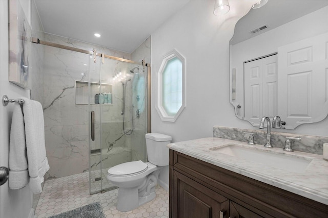 bathroom with tile patterned flooring, vanity, walk in shower, and toilet