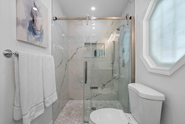 bathroom featuring tile patterned flooring, walk in shower, and toilet