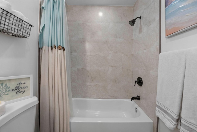 bathroom with shower / bath combo with shower curtain