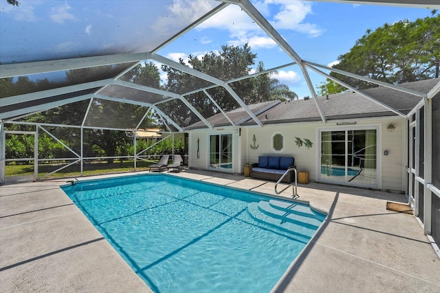 view of pool featuring a patio area and a lanai