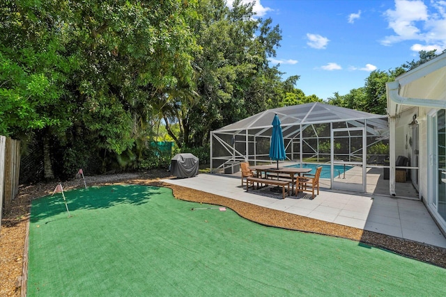 view of yard featuring a patio and a lanai