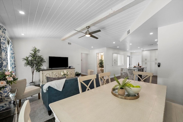 dining room featuring ceiling fan, beamed ceiling, and wooden ceiling