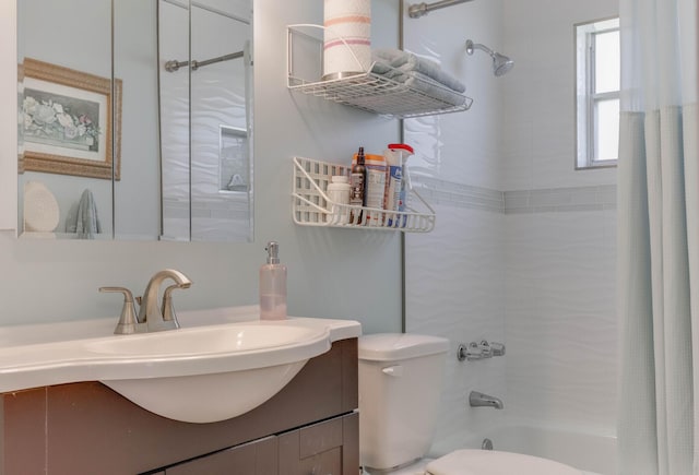 full bathroom with vanity, toilet, and shower / bath combo with shower curtain