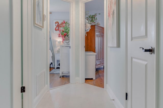 hall with light hardwood / wood-style floors