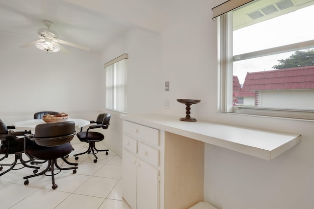 dining area with ceiling fan and light tile patterned floors