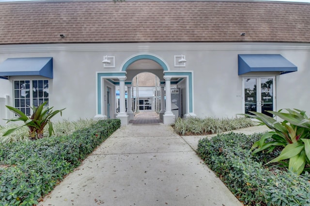 property entrance featuring french doors