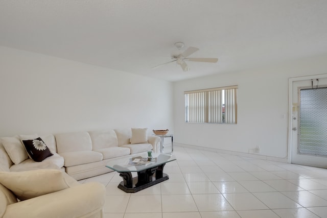 living room featuring ceiling fan and light tile patterned floors