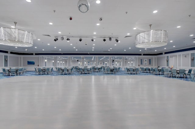 workout area with a chandelier